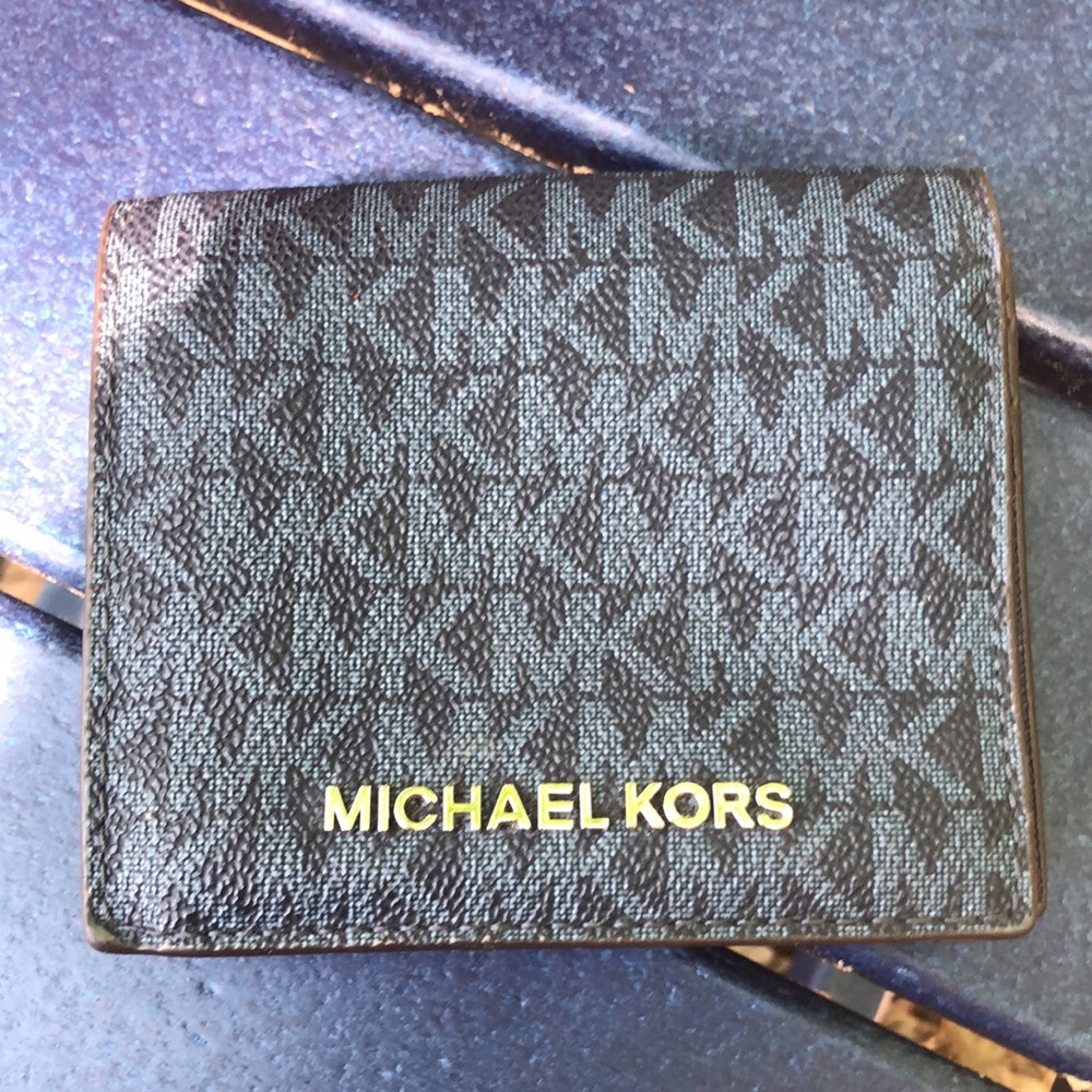 Michael Kors black wallet.